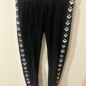 Converse black velour sweatpants with white chevron stripe. Size M 10-12 yearS